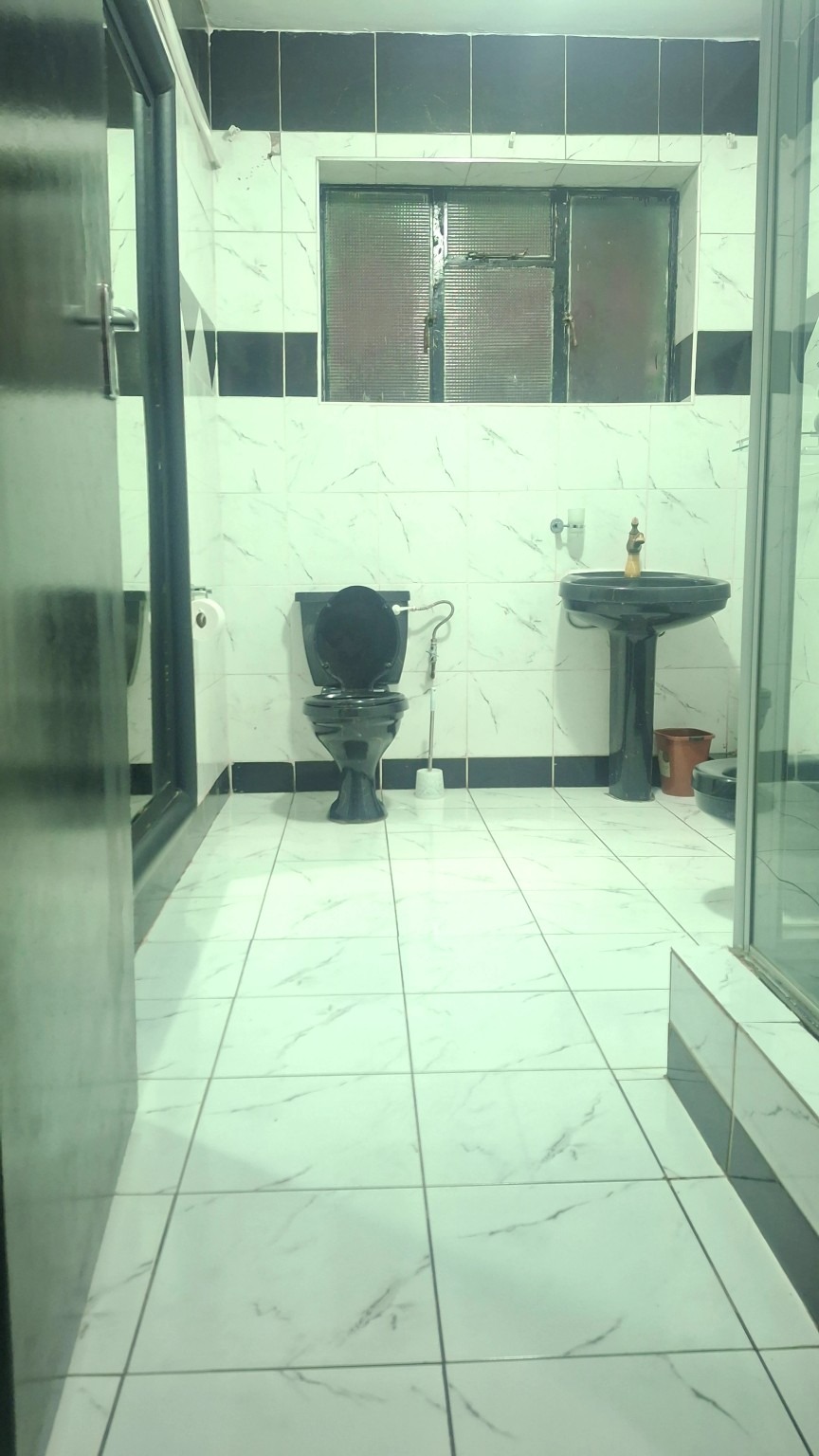 Standard Suite bathroom with toilet and basin at The Standard Hotel